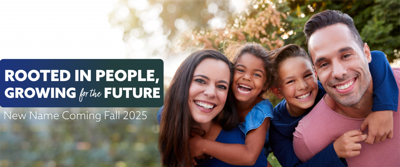 A happy family with the text rooted in people growing for the future